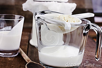 Kefir Grains Being Strained Stock Photo