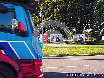 A truck drives past large election posters with the chancellor candidates of SPD Editorial Stock Photo
