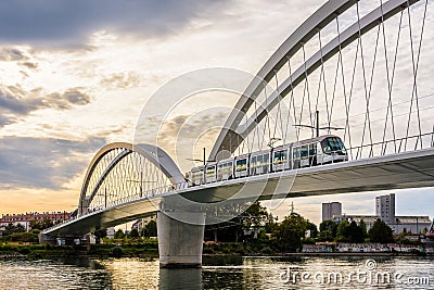 A streetcar is crossing the railway bridge between Strasbourg, France, and Kehl, Germany Editorial Stock Photo