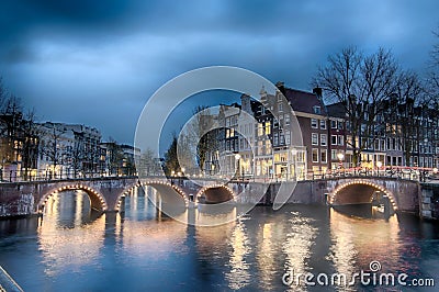 Keizersgracht inersection bridge view of Amsterdam canal and historical houses during twilight time, Netherland Stock Photo