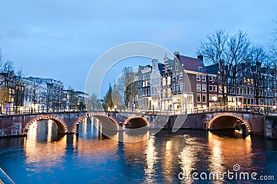 Keizersgracht inersection bridge view of Amsterdam canal and historical houses during twilight time, Netherland Stock Photo