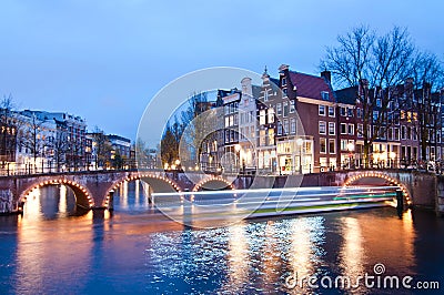 Keizersgracht intersection bridge view of Amsterdam canal and historical houses during twilight time, Netherland Stock Photo