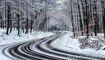 Kekesteto, Hungary - Winding winter road at the mountains of Matra near Kekesteto. Curved asphalt road with snowy trees Stock Photo