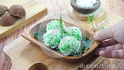 Kelepon cake or klepon is a traditional food from Indonesia made of glutinous rice flour brown sugar grated coconut Stock Photo