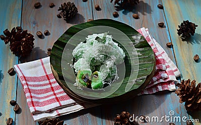 kelepon or klepon made from glutinous rice flour and filled with brownn sugar covered with grated coconut. indonesian food. Stock Photo