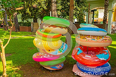 KEMER, TURKEY: Inflatable rescue colorful swimming circles in the store in Kemer Editorial Stock Photo