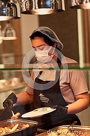 Kemer, Turkey - May, 24: Service people picking up of food in the restaurant on the all-inclusive system due to the Editorial Stock Photo