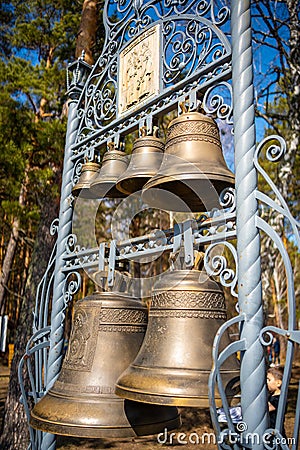Kemerovo, Russia - April 16, 2022: Bells near Church of Cyril and Methodius in open-air museum Tomsk pisanitsa located Editorial Stock Photo