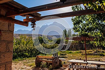 Kempin in the mountains, Cozy courtyard of an old house against the backdrop of mountains Stock Photo