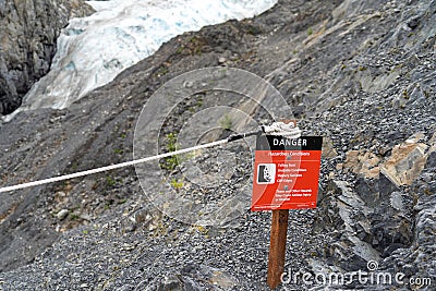 Kenai Fjords National Park - sign warns of dangers for hikers on the Exit Glacier trail in Alaska Editorial Stock Photo