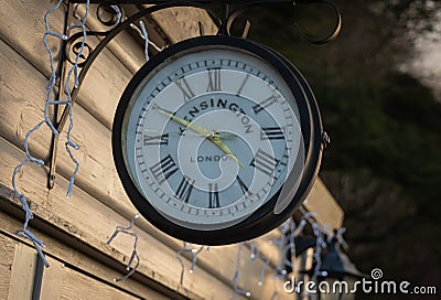 A Kensington London clock in late winter afternoon sun light Editorial Stock Photo