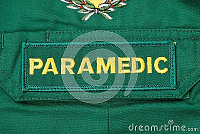 British paramedics`s NHS PARAMEDIC uniform badge. Editorial Stock Photo