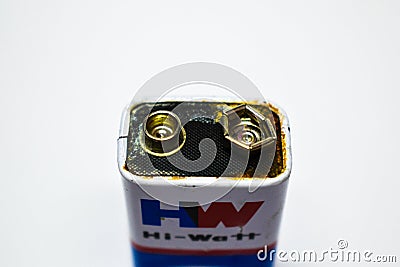 07/06/2020- Kerala,India: Close-up of an old leaked 9V dry cell battery of HW brand on white background. Selective focus applied Editorial Stock Photo