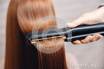 Keratin recovery hair and protein treatment pile with professional ultrasonic iron tool. Concept straighten Stock Photo