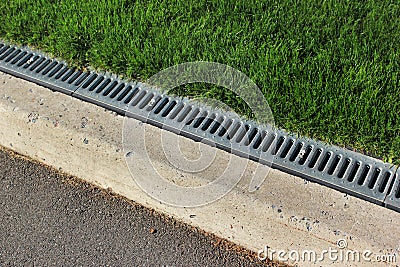Kerbside and rainwater drainage system in a park Stock Photo