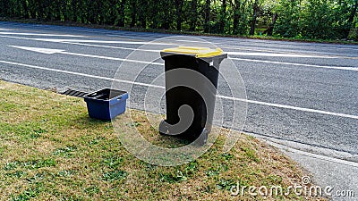 Kerbside recycling bins in Motueka, one for glass the wheelie bin for paper, plastic and metals Stock Photo
