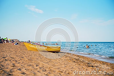 Kerch Crimea 07 18 2023 - Summer, city beach, rescue yellow boat with the inscription lifeguard Editorial Stock Photo