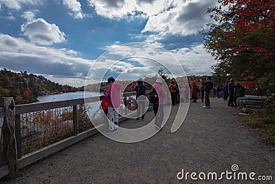 Tourists enjoy taking photos near the visitor center at overlooking Lake Minnewaska Editorial Stock Photo