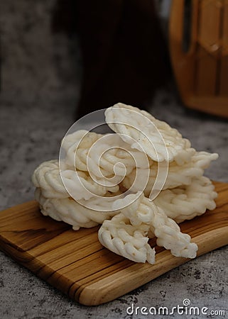 Kerupuk ikan putih or kerupuk warung is Indonesian deep fried crackers made from starch mixed with flavorings Stock Photo