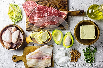 Ketogenic diet food. Balanced low-carb food background. Fish, meat, cheese, nuts on a white background. Healthy balanced food with Stock Photo