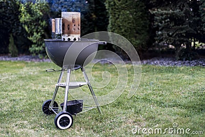 Kettle barbecue charcoal grill roasting BBQ standing on gras ready for action Stock Photo