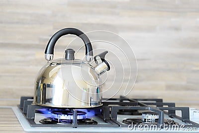 Kettle on a gas stove flame burn not boiling Stock Photo