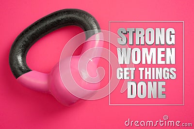 Kettle Weights on Pink Background with Inspirational Quote. Strong Women Get Things Done. Stock Photo