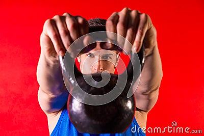 Kettlebell man portrait looking through the handle Stock Photo