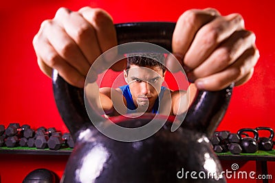 Kettlebell man portrait looking through the handle Stock Photo