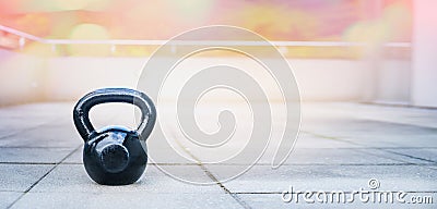 The kettlebell for outdoor sports, stands the terrace of the house Stock Photo
