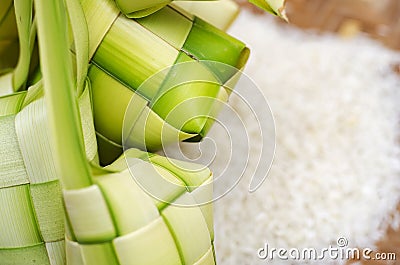 Ketupat casing and rice in bamboo container. traditional malay delicacy during Malaysian eid Stock Photo