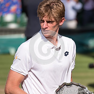 Kevin Anderson, South African player, holding his plate on centre court as runner up in the Wimbledon mens finals Editorial Stock Photo