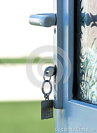 Key in Door Lock Stock Photo