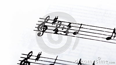 Key, double time signature symbol and violin clef. Musical notation macro, closeup. Single line sheet music detail example Stock Photo