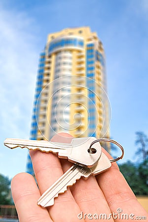 The key on the hand with house Stock Photo