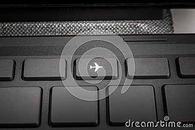 Key on the keyboard flight mode, no communication, isolated, self-isolation and no travel, quarantine measures, borders Stock Photo