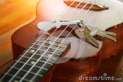 Key with keychain in form of guitar Stock Photo