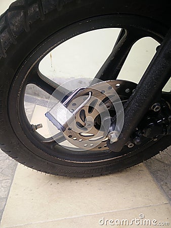 Key lock on motorbike vehicle disc brake Editorial Stock Photo
