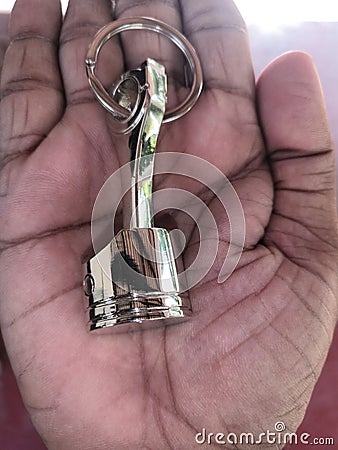 Key tag in hand piston connecting rod Stock Photo