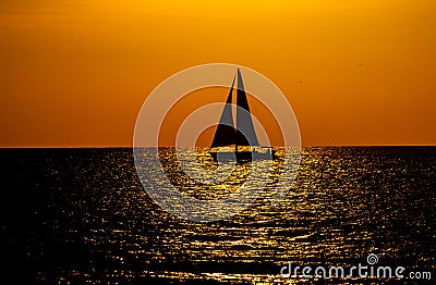 Key West Sunset with Sailboat Silhouette Stock Photo