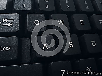 The keyboard is black and you can see the letters and numbers Stock Photo