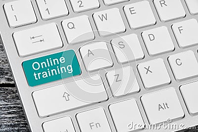 Keyboard with blue key word Online Training button Stock Photo