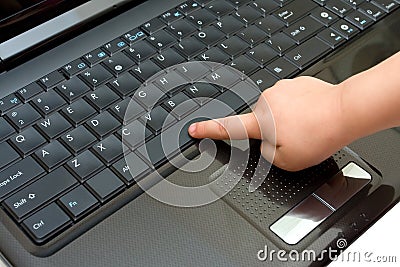 Keyboard and child finger Stock Photo