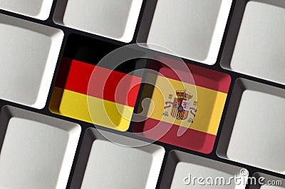 Keyboard German Germany Spanish Spain flag online language learning translation Stock Photo