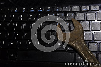 Keyboard Laptop with Wrench repair PC or laptop concept Stock Photo