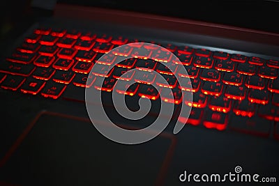 Illuminated Keyboard for gaming. Backlit keyboard with versatile color schemes. Stock Photo