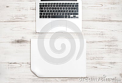 Keyboard over wooden desk. Paper background. Office workspace Stock Photo