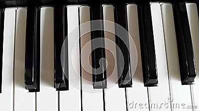 Keyboard of the piano - white and black keys Stock Photo
