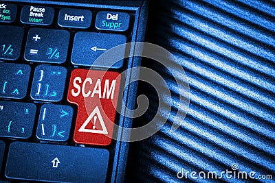 Keyboard with a red key and the message scam alert Stock Photo