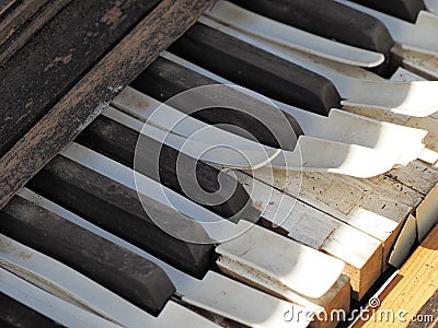 Keys of a desolate old weathered piano Stock Photo